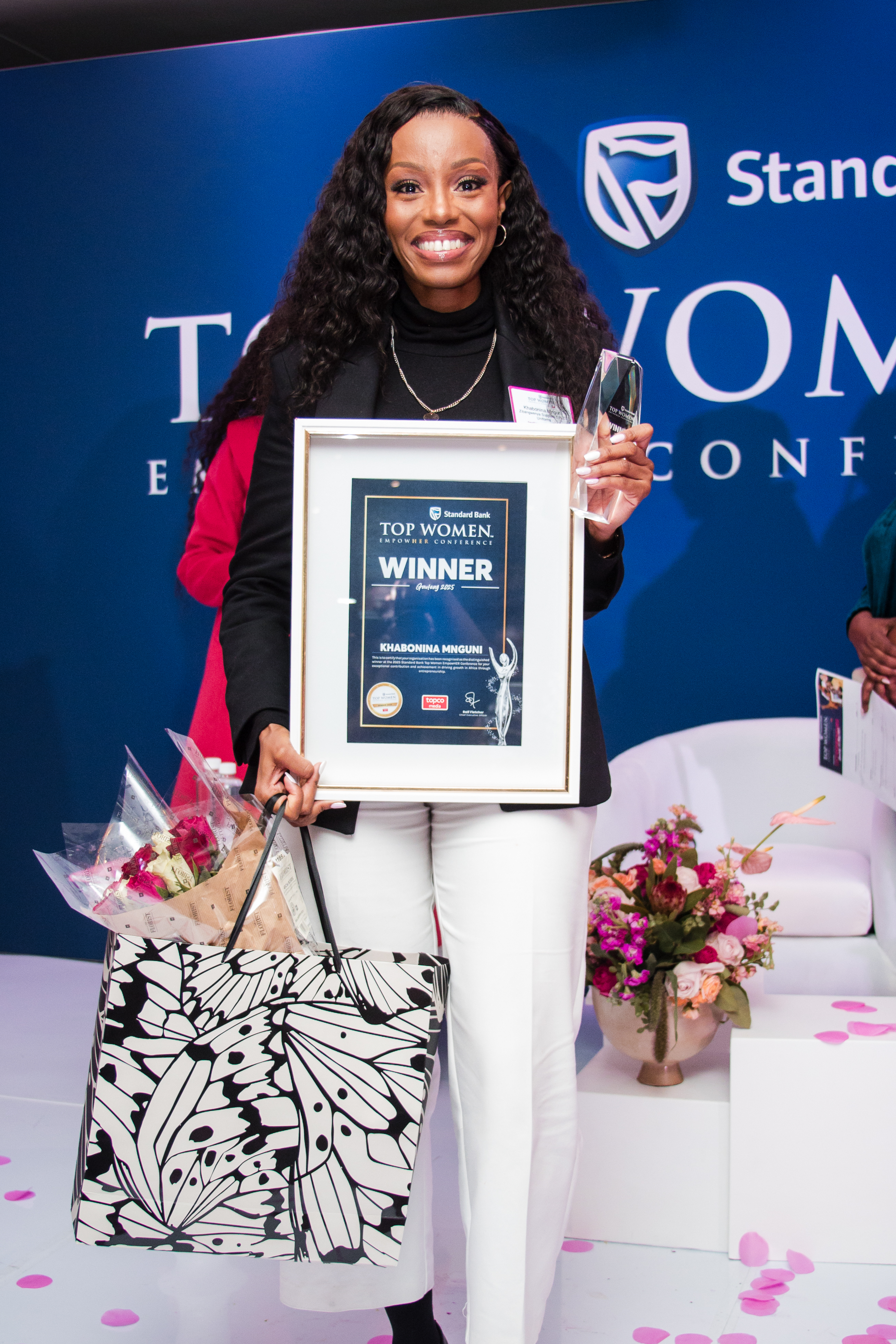 Khabo Mnguni receiving Standard Bank Top Women Empower Conference Winner award 2025